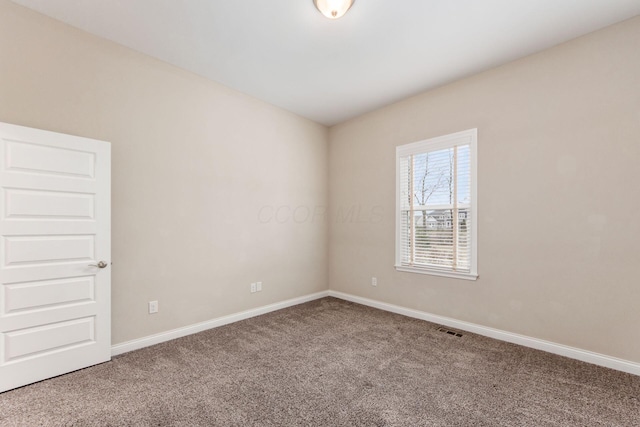 spare room featuring carpet floors