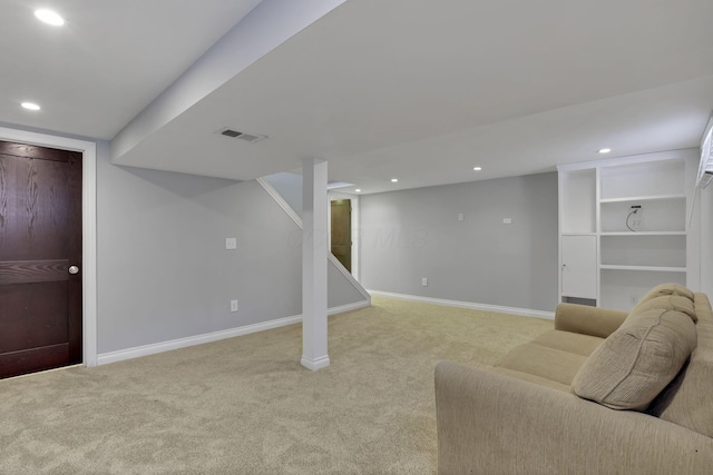 basement featuring light colored carpet