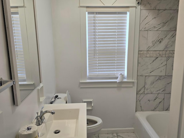 full bathroom with sink, tiled shower / bath combo, a wealth of natural light, and toilet