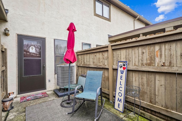 doorway to property featuring cooling unit