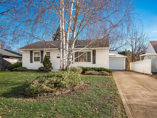 ranch-style home featuring a front yard and a garage