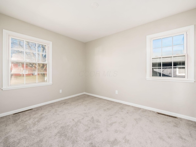 spare room featuring carpet floors