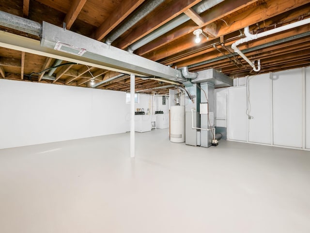 basement featuring gas water heater and heating unit