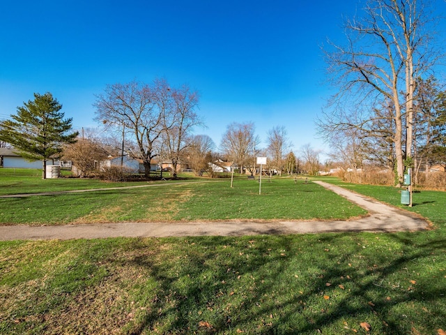 view of property's community with a lawn