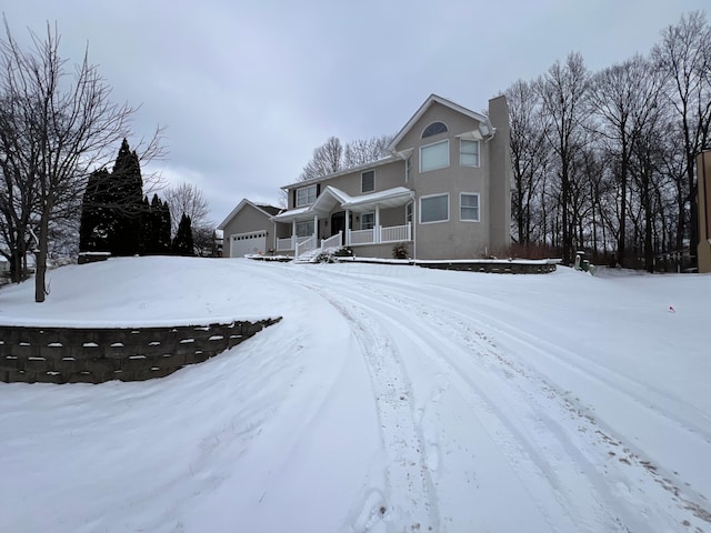 view of front facade with a porch and a garage