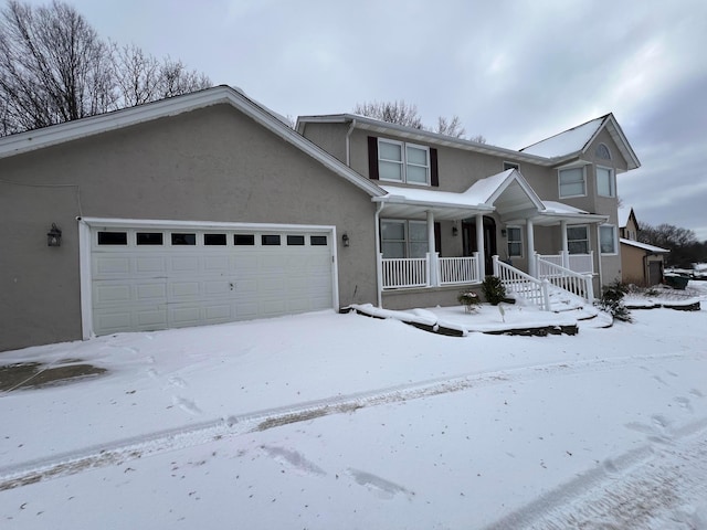 front of property featuring a porch and a garage