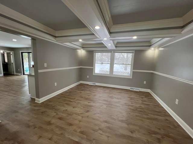 empty room with crown molding, beamed ceiling, dark hardwood / wood-style floors, and coffered ceiling