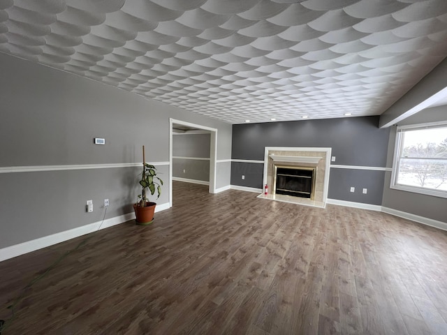 unfurnished living room featuring hardwood / wood-style floors and a fireplace