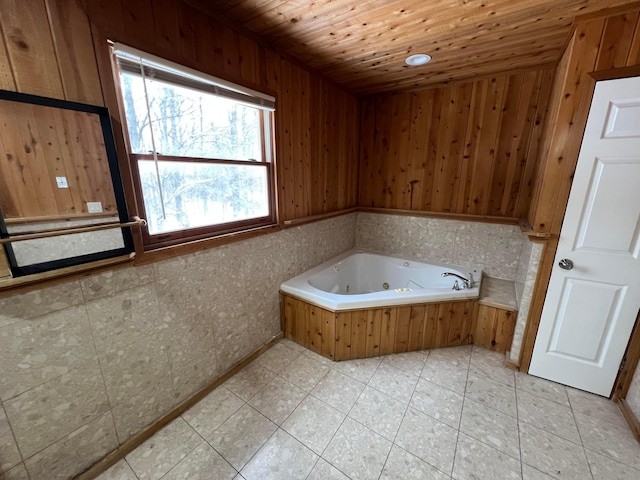 bathroom featuring wooden ceiling, a tub, and wooden walls