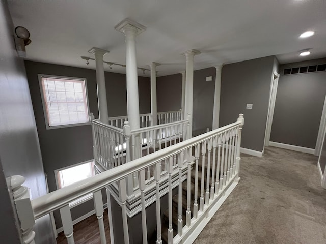 hallway with carpet floors