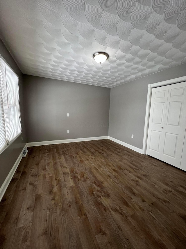 interior space with dark wood-type flooring