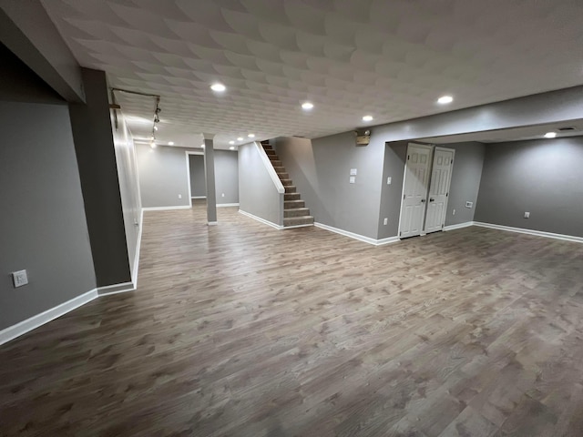 basement featuring hardwood / wood-style floors