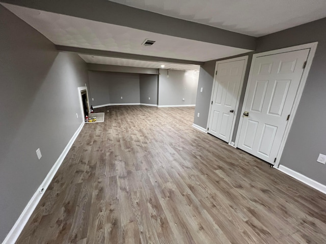 basement featuring wood-type flooring