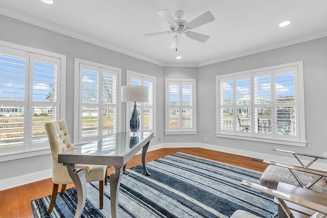 office space with hardwood / wood-style floors, ceiling fan, and ornamental molding