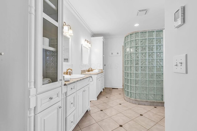 bathroom with tile patterned flooring, vanity, and crown molding