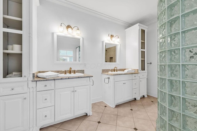 bathroom featuring crown molding, tile patterned flooring, and vanity