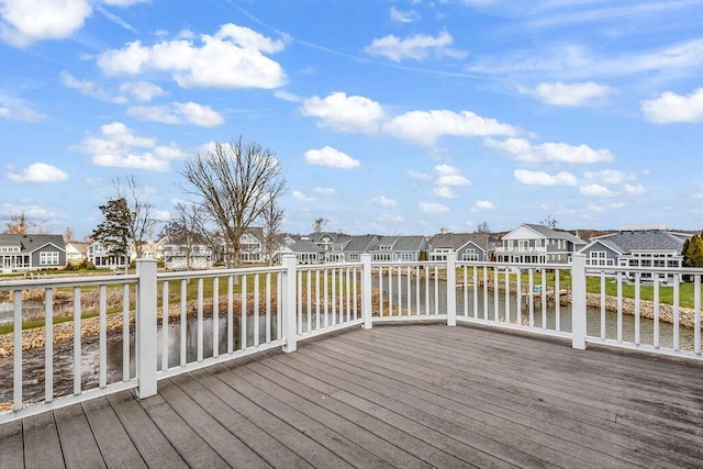 wooden terrace with a water view