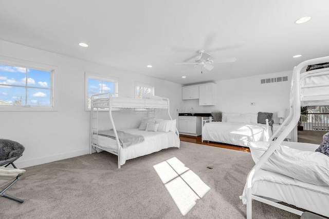 carpeted bedroom with ceiling fan