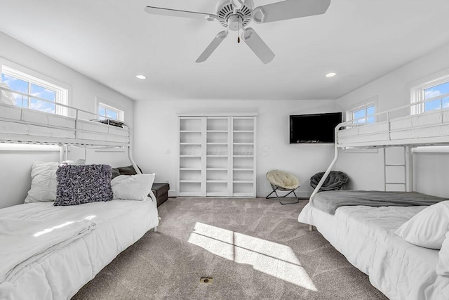 carpeted bedroom with ceiling fan