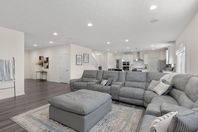 531 White Fawn Run, Delaware, OH 43015 - living room featuring recessed lighting, dark wood-style flooring, baseboards, and stairway