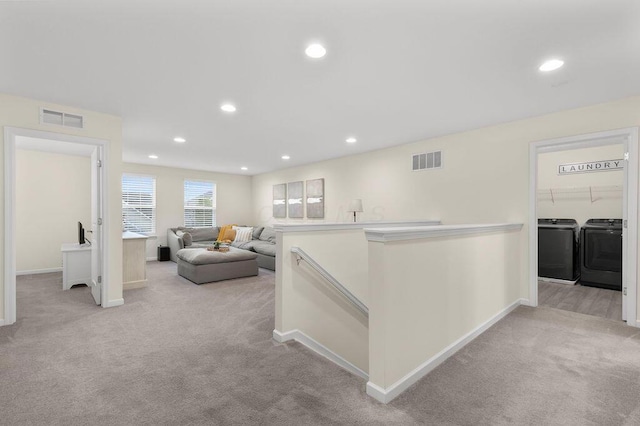 531 White Fawn Run, Delaware, OH 43015 - hallway with separate washer and dryer, light carpet, baseboards, recessed lighting, and an upstairs landing