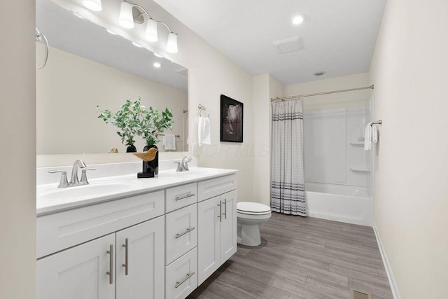 531 White Fawn Run, Delaware, OH 43015 - bathroom featuring toilet, double vanity, shower / tub combo, wood finished floors, and baseboards