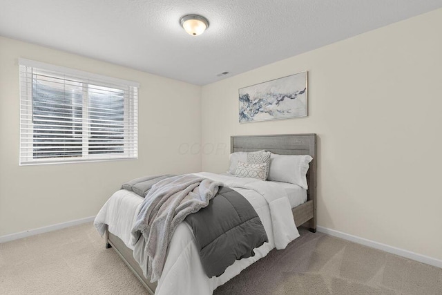 531 White Fawn Run, Delaware, OH 43015 - carpeted bedroom with baseboards and a textured ceiling