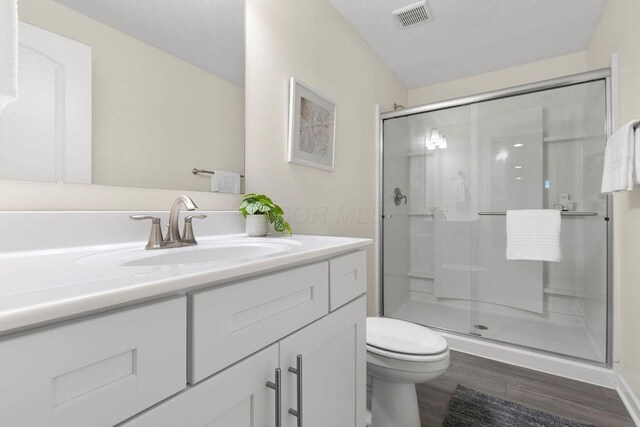531 White Fawn Run, Delaware, OH 43015 - full bathroom with wood finished floors, toilet, a shower stall, and vanity