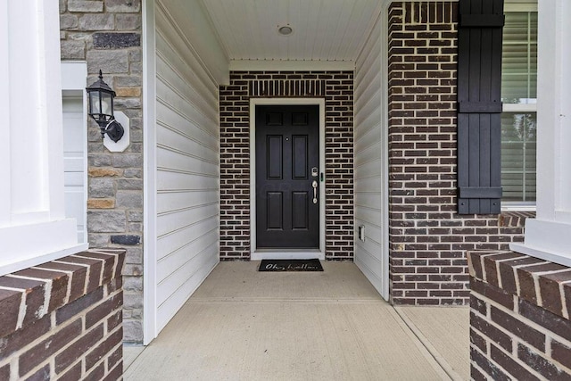531 White Fawn Run, Delaware, OH 43015 - doorway to property featuring brick siding and stone siding
