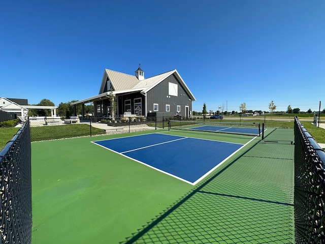 view of tennis court with fence