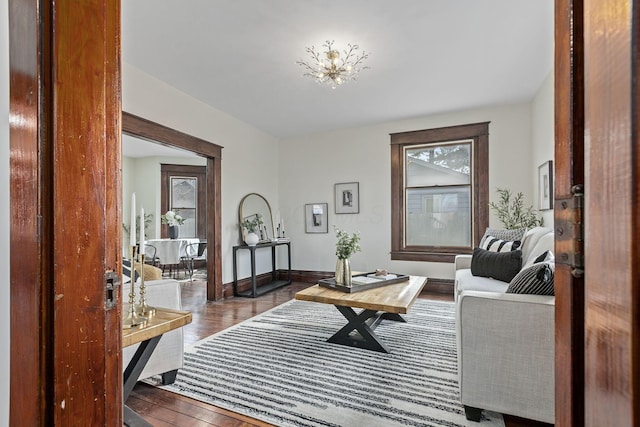 interior space featuring dark hardwood / wood-style flooring and a chandelier