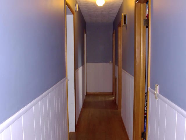 hall with wood-type flooring