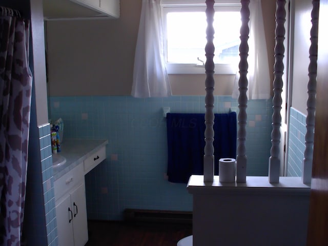 bathroom featuring a baseboard heating unit