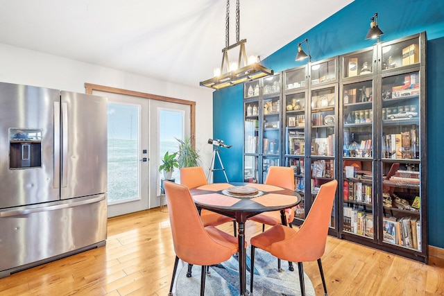 dining area featuring hardwood / wood-style floors and french doors