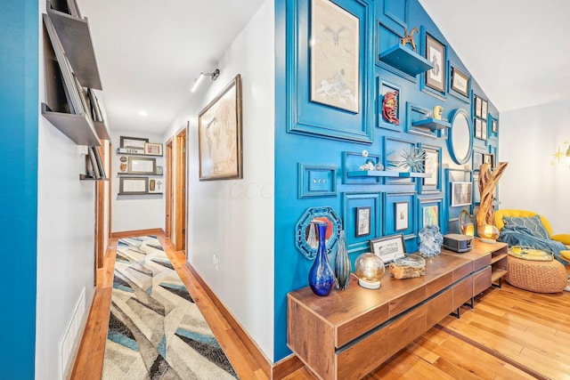 hallway featuring light hardwood / wood-style flooring