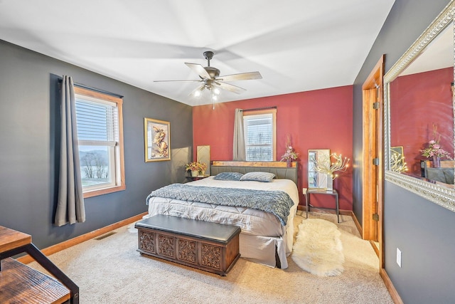 bedroom featuring ceiling fan and light colored carpet