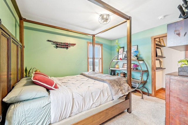 bedroom featuring light colored carpet