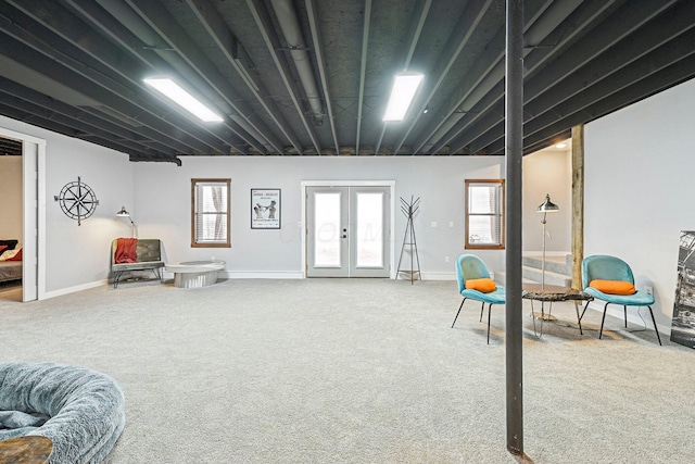 interior space with plenty of natural light, carpet floors, and french doors