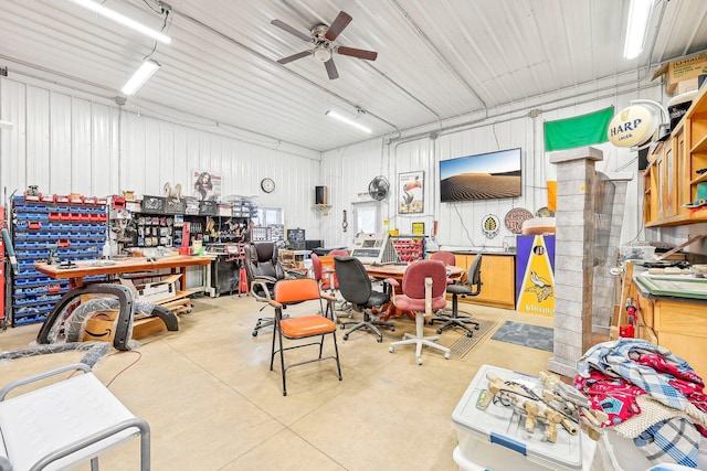 garage with a workshop area and ceiling fan