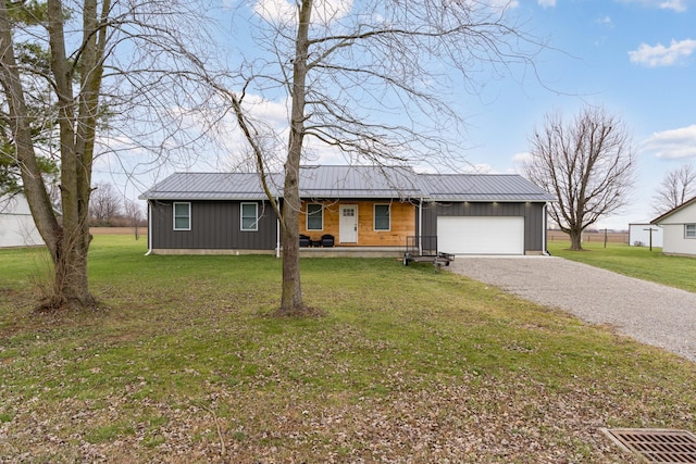 single story home featuring a porch, a garage, and a front lawn