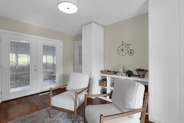 living area with french doors and dark wood-type flooring