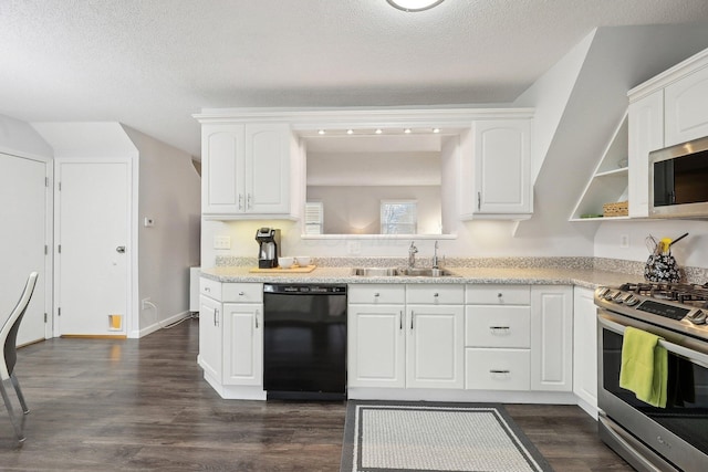 kitchen with sink, white cabinets, stainless steel appliances, dark wood-type flooring, and a textured ceiling