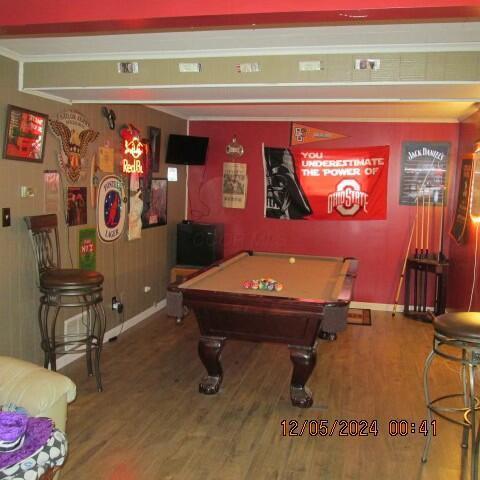 recreation room with hardwood / wood-style flooring and pool table