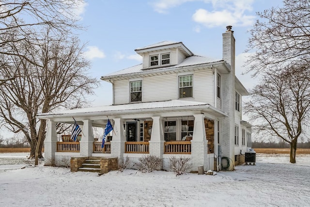 view of front of house with covered porch and cooling unit