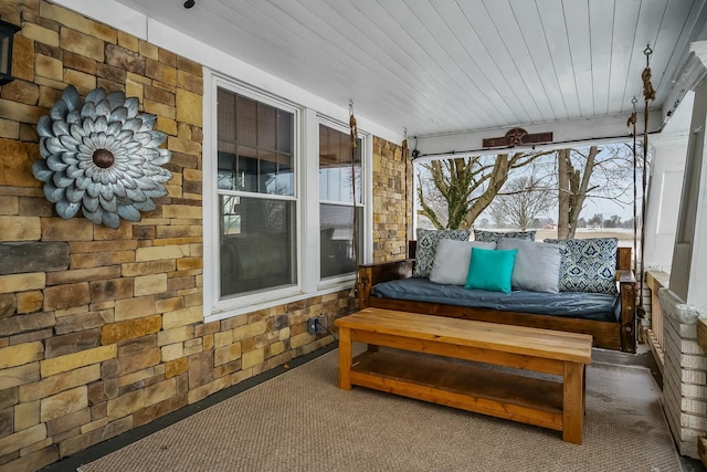 sunroom featuring wood ceiling