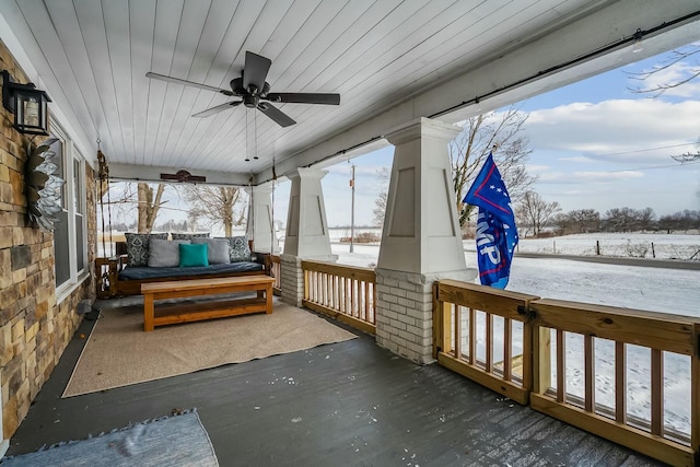 exterior space featuring covered porch and ceiling fan