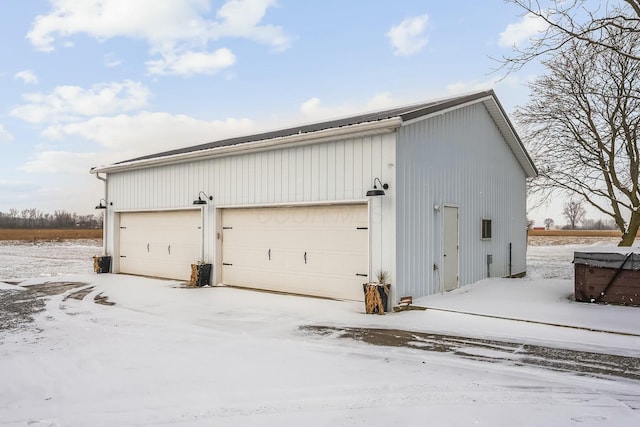 view of snow covered garage