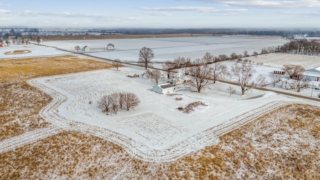 snowy aerial view featuring a rural view