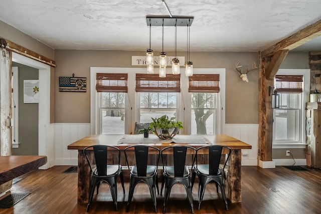 dining area featuring dark hardwood / wood-style floors