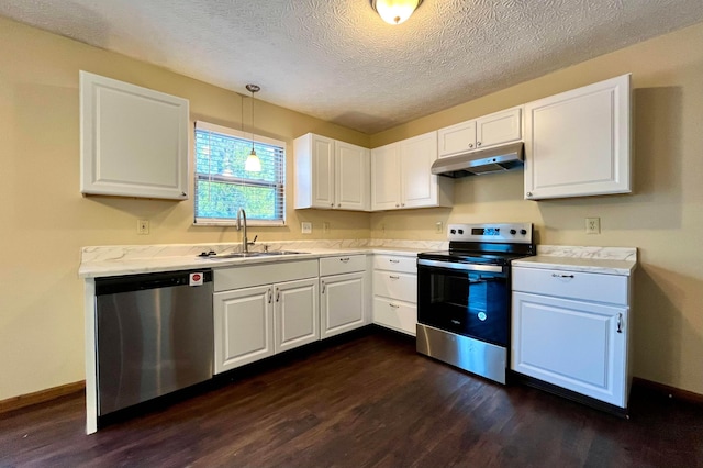 kitchen with white cabinetry, sink, pendant lighting, and appliances with stainless steel finishes